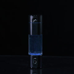 Herbalistas Nord Hydrogen Water Bottle in Horizon Black, 280ml, with 5000 PPB hydrogen water drink accessory.