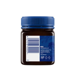 Jar of Herbalistas Haddrells Manuka Honey UMF5+ with MGO83+ in a 250g container, showcasing the honey's golden, thick texture.