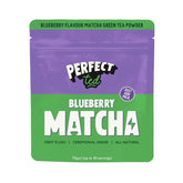 Herbalistas PerfectTed ceremonial grade blueberry matcha powder in a 75g container, vibrant blue-green powdered tea with blueberries.