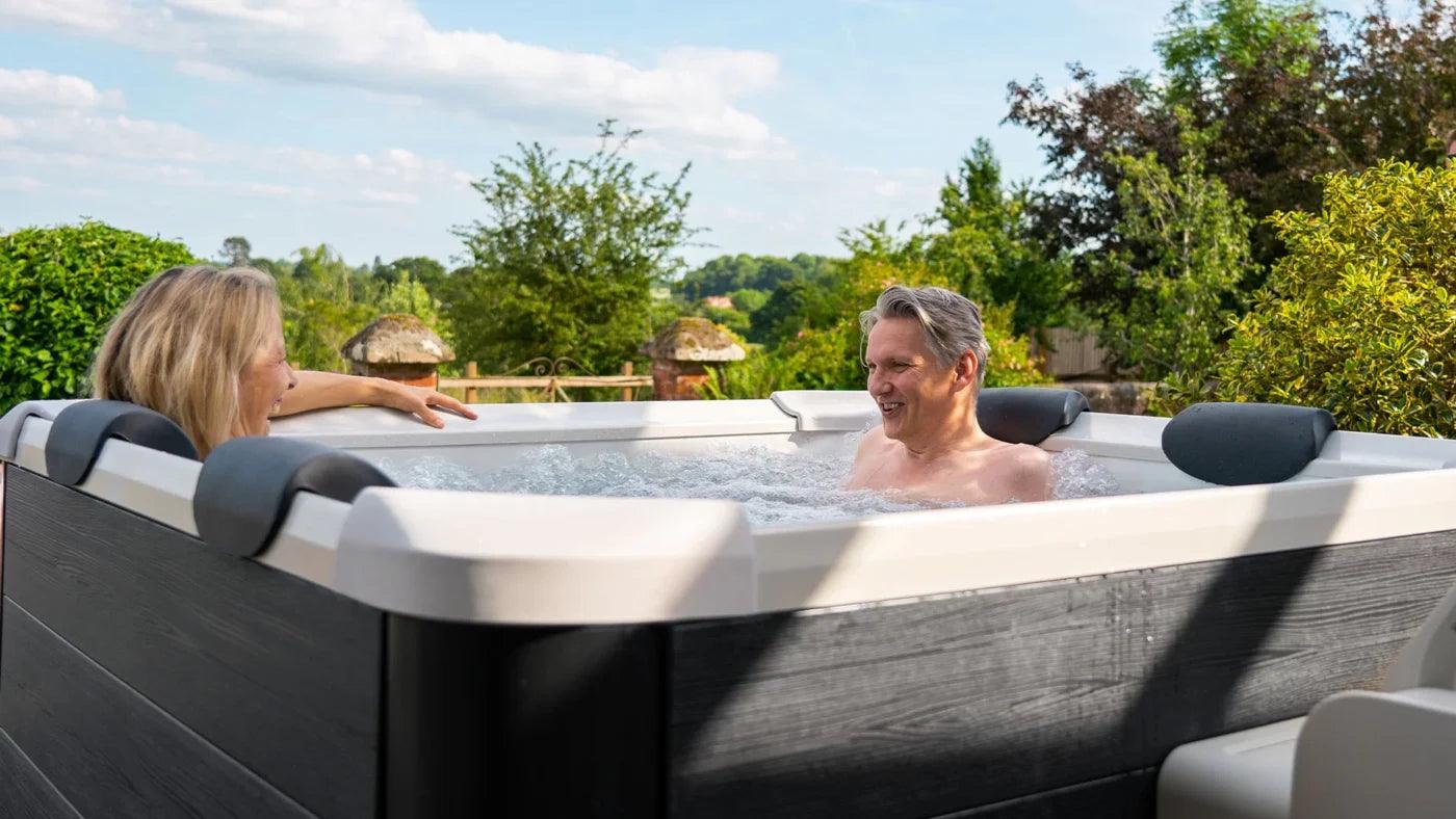 VIKING FITNESS MSpa Oslo Plus outdoor hot tub with seating and control panel, set up in a backyard patio.