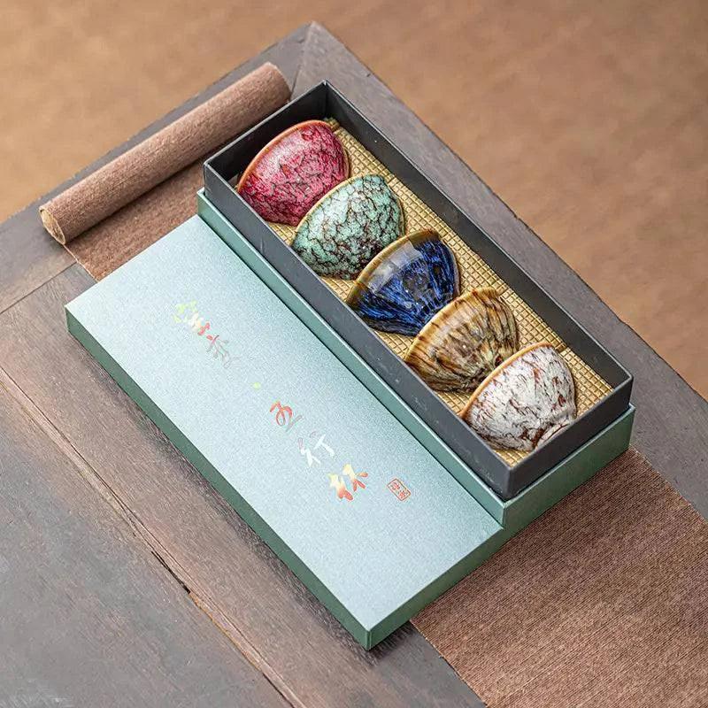 Handmade ceramic teacup set with intricate designs, perfect for enjoying hot beverages in a stylish drink accessory by TEMU.