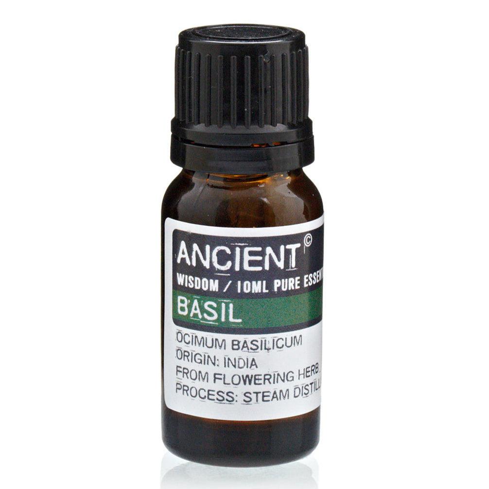 Bottle of AW GIFTS Basil Essential Oil, 10ml, for skincare, with fresh basil leaves in the background.