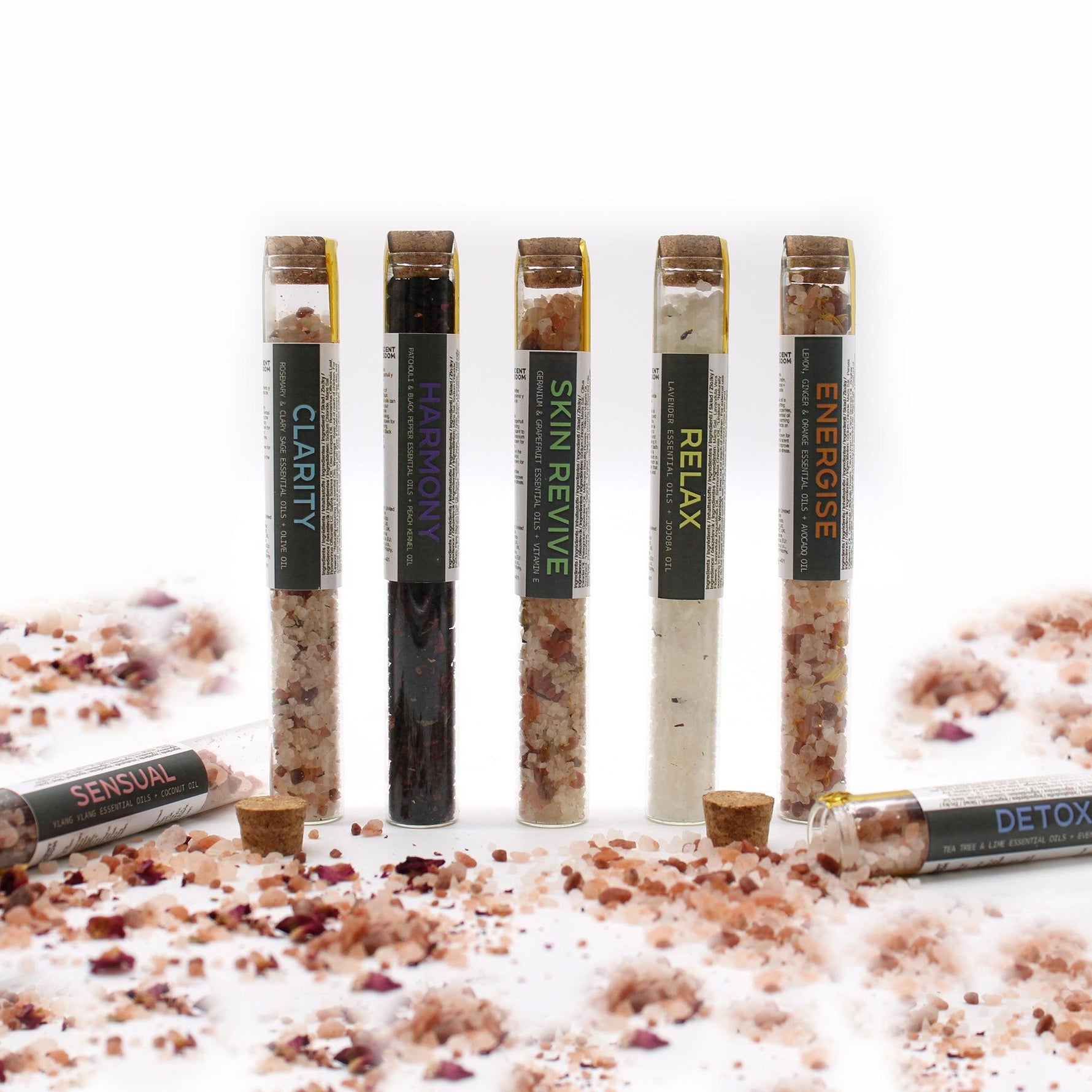Set of seven AW GIFTS bath salts in vials, arranged in a gift pack for relaxing bath experiences.