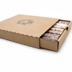 Set of seven AW GIFTS bath salts in glass vials, perfect for gifting, with colorful labels and elegant packaging.