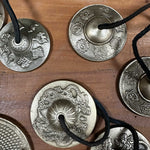 Tibetan Tingsha bell by AW Gifts featuring Five Buddha design, approximately 9.5cm, traditional accessory for meditation and rituals.