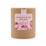Frankincense and rose bath bomb by AW GIFTS with rose petals and herbal ingredients in a clear glass bowl.