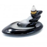 Small back flow incense burner with pebbles by AW GIFTS, showcasing a decorative accessory for incense relaxation.
