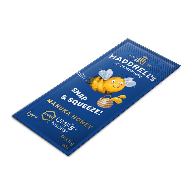 Herbalistas Haddrells Manuka Honey UMF5+ single-serve sachets for kids, 10-pack, with natural honey in individual portions.