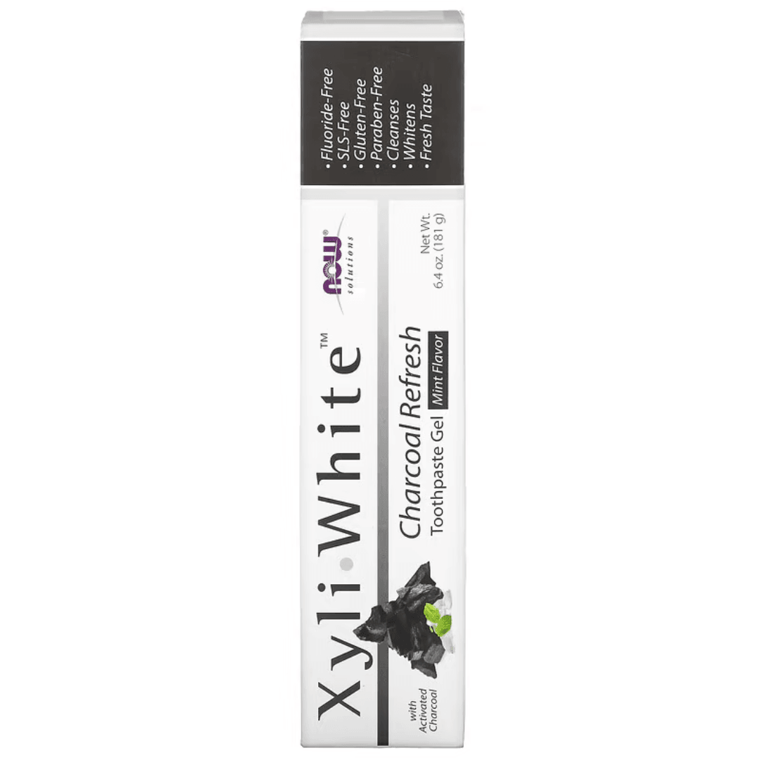 MKSTAVRINOS mouthwash bottle featuring NOW Foods XyliWhite Charcoal Refresh Mint toothpaste gel, 6.4 oz, with mint flavor and black packaging.