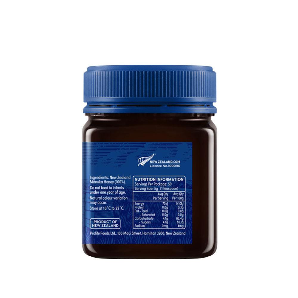 Herbalistas Haddrells Manuka Honey UMF5+ MGO83+ in a 250g jar, showing the honey's golden, thick texture and label.