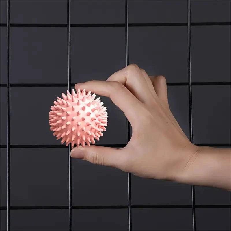 Portable massage ball by TEMU, showing a compact, textured massage ball perfect for muscle relief and relaxation.
