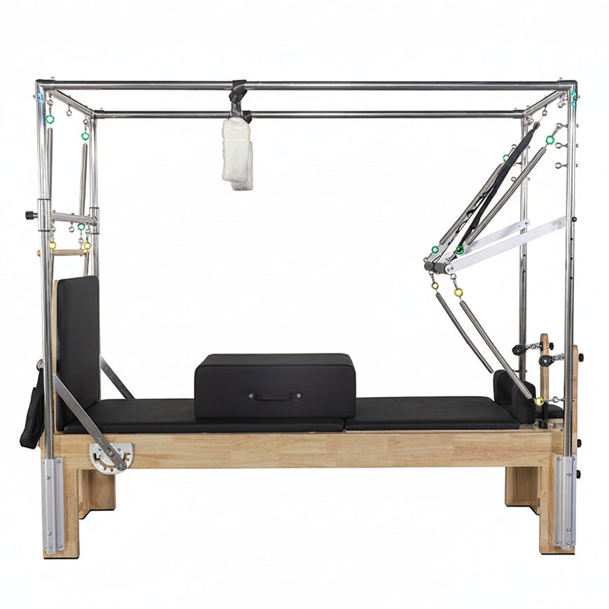 Viking Fitness Pilates Cadillac Reformer with padded carriage and adjustable bars for full-body Pilates workouts.