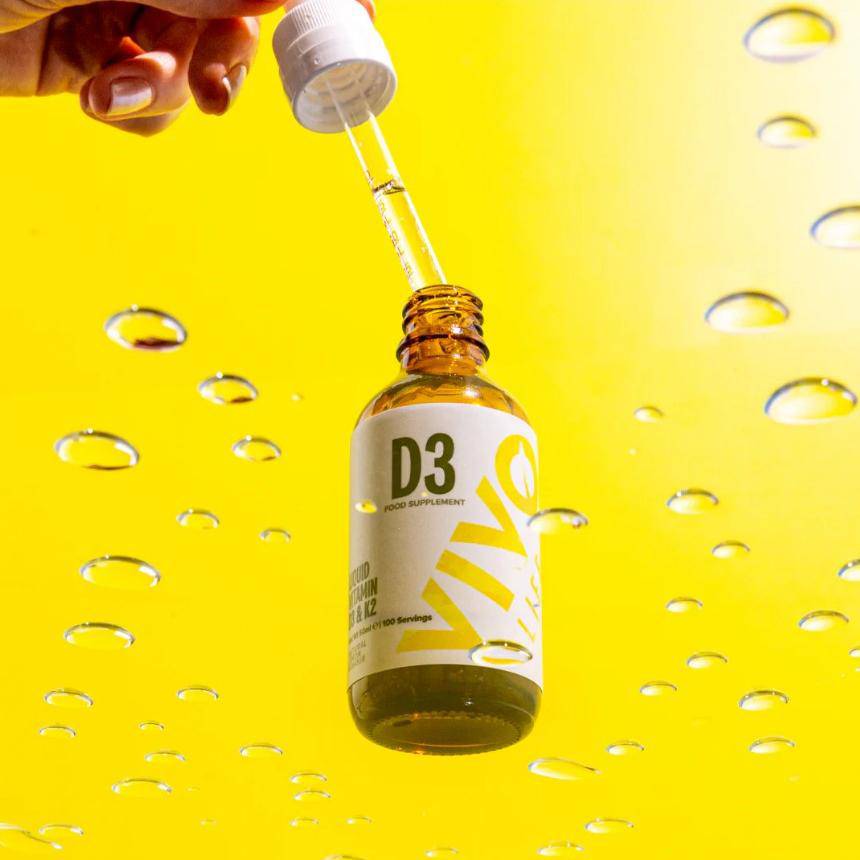 Vivo Life Vitamin D3 with K2 plant-based supplement bottle showing label with supplement details and vibrant green design