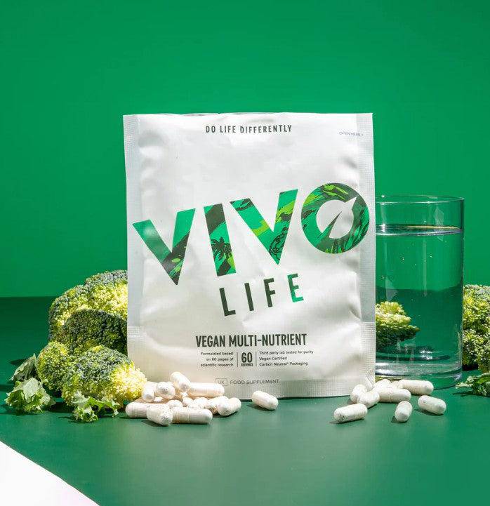 Vivo Life vegan multinutrient and mineral supplement bottle with colorful label and capsules inside, on a white background.