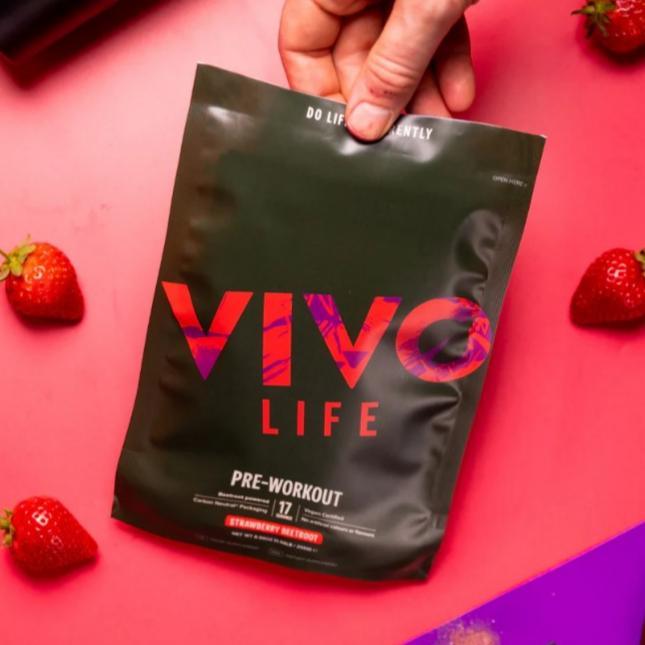 Vivo Life pre workout supplement container with label, featuring natural ingredients and vibrant branding.