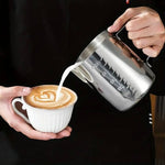 Stainless steel milk frothing pitcher by TEMU with a sleek, polished finish, ideal for steaming and pouring frothed milk.