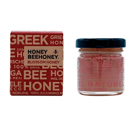 Bottle of LV Natural Foods Luxury Blossom Honey, a superfood with golden honey drizzled from a jar.