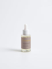 Selfnamed Rosemary Hair and Scalp Strengthening Oil bottle with rosemary sprigs and dropper for nourishing hair treatment.