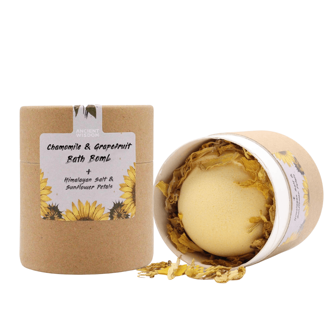 AW GIFTS chamomile and grapefruit bath bomb with floral and citrus scents, shown in a relaxing bath setting.