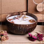 Soy wax candle in a coconut bowl by Velarte, featuring a natural, handcrafted design with a soft, inviting glow.