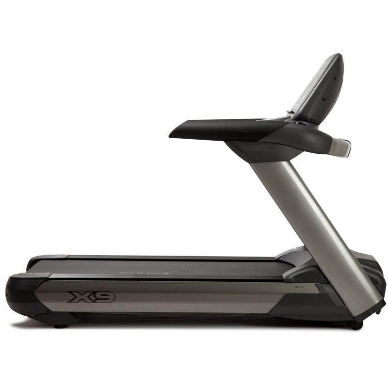 Side view of the VIKING FITNESS SHUA X-9 professional electric treadmill showing its running surface and control panel.