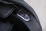 VIKING FITNESS A-310 massage chair in black with detailed close-up showing plush upholstery and ergonomic design.