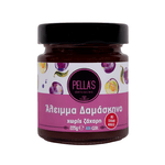 Pella's Delicacies plum spread in a jar, showcasing its rich purple color and smooth texture, ideal for spreading on bread.