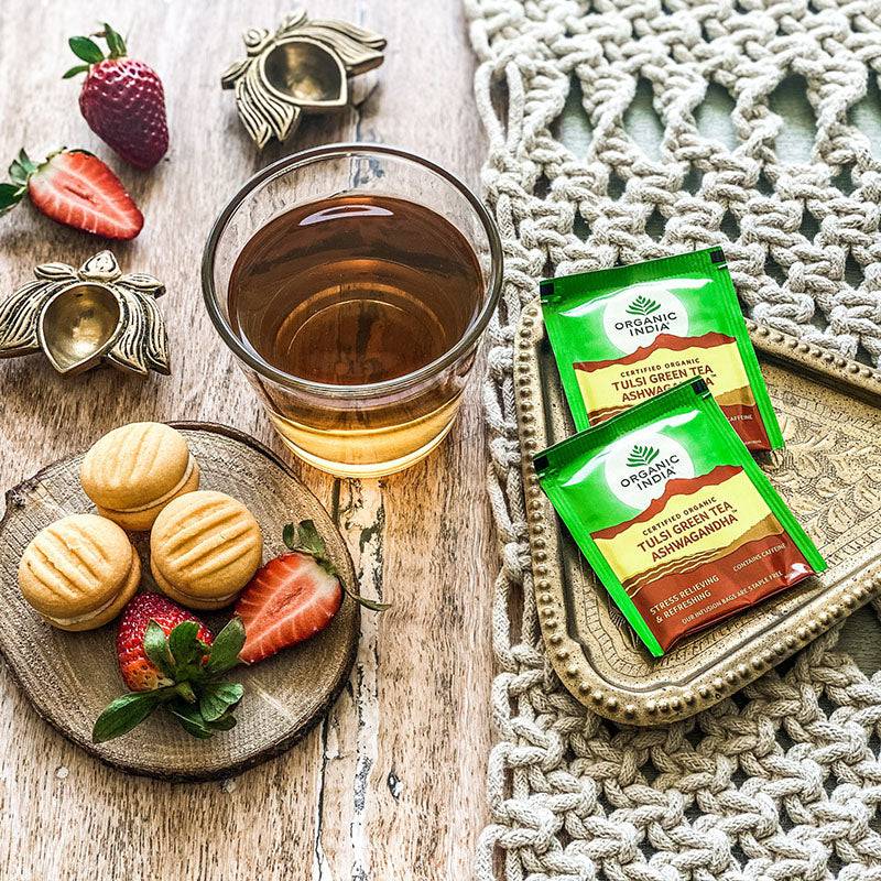 Organic India BIO Tulsi Green Tea with Ashwagandha, 25 infusion bags, featuring fresh tea leaves and herbal ingredients.