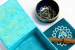 AW Gifts Chakra Singing Bowl Throat accessory, handcrafted metal bowl for meditation and sound therapy, displayed on a wooden surface.