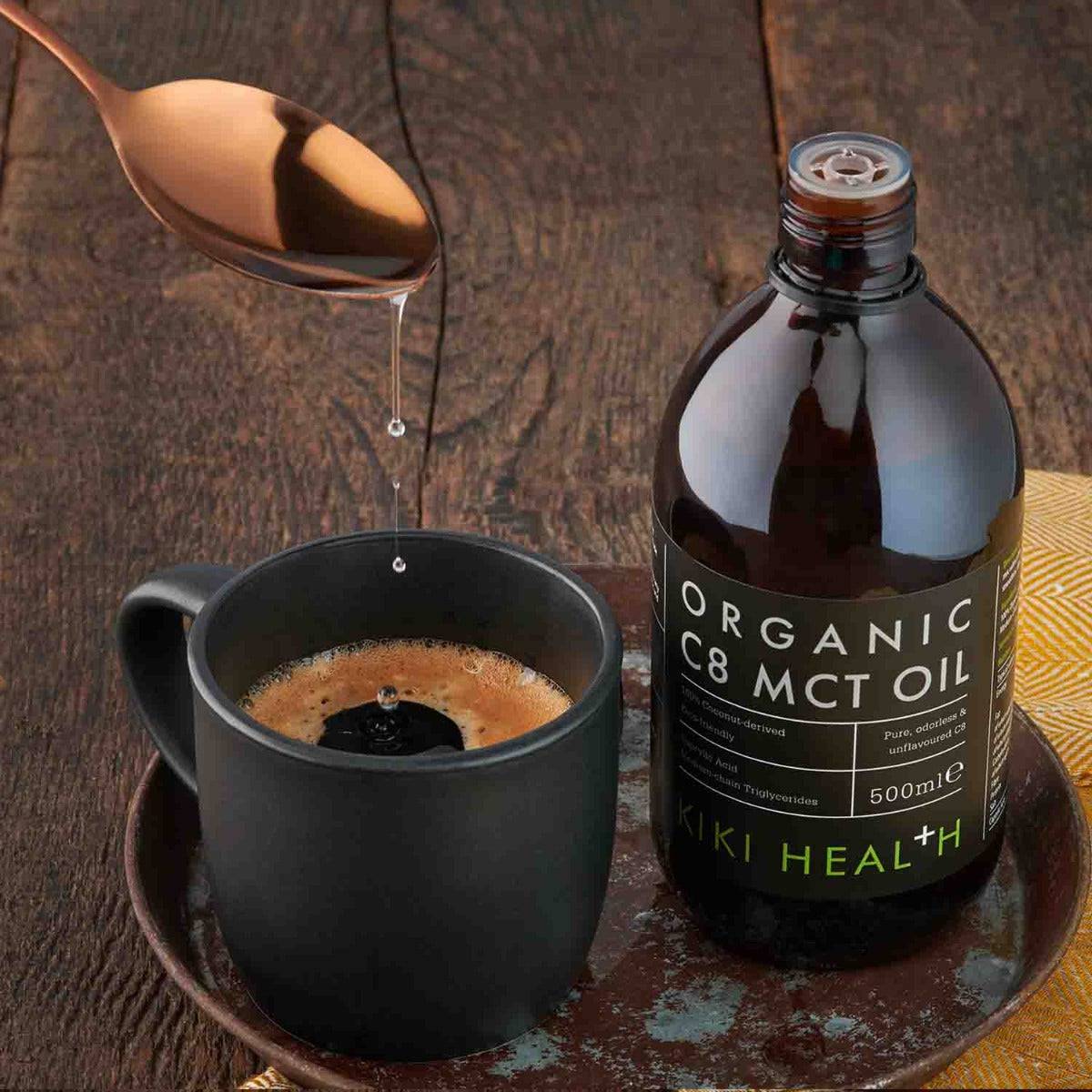 Organic C8 MCT oil supplement bottle from Kiki Health, 500ml, with a clear label and pump dispenser, on a neutral background.