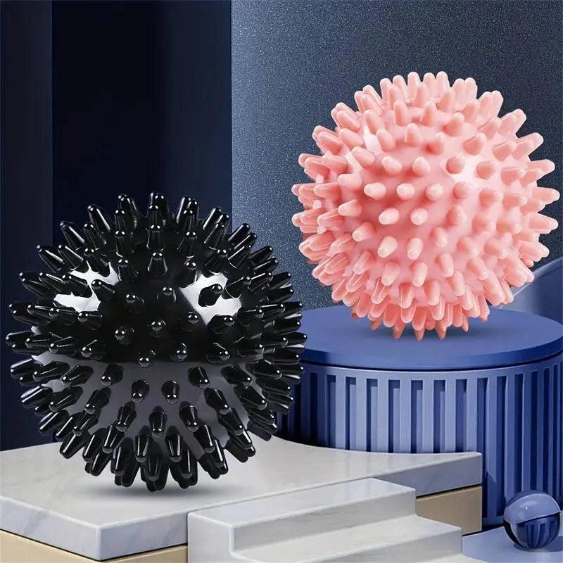 Portable TEMU massage ball for muscle relief, shown in close-up with textured surface for targeted pressure therapy.