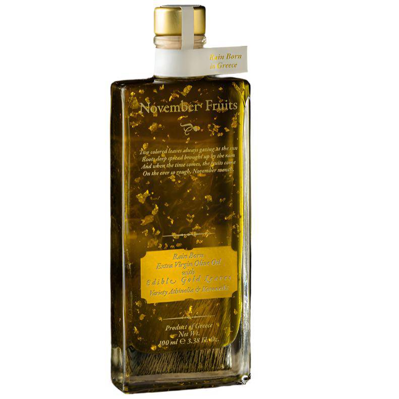 Elixir Flavours Liquid Gold olive oil with edible gold flakes in a 100ml bottle, showcasing the luxurious golden oil with gold flakes.