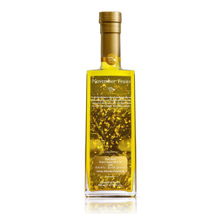 Bottle of Elixir Flavours Virgin Olive Oil PGI Laconia, showcasing a dark glass container with a gold cap and olive oil label.