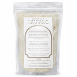 Green and white packaging of AW GIFTS Longevity Oat & Honey Epsom Bath Salt Spa Relax Blend with natural ingredients and relaxing spa theme.