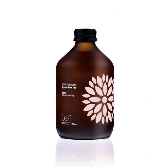 VIGO Kombucha Longbrew BIO Rose tea in 330ml bottle by Herbalistas, showing a glass with pink rose-flavored kombucha.