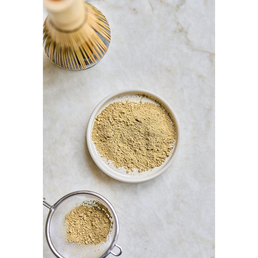Organic Moya Hojicha powder by Herbalistas, loose roasted Japanese green tea leaves and powdered form in a 100g package.
