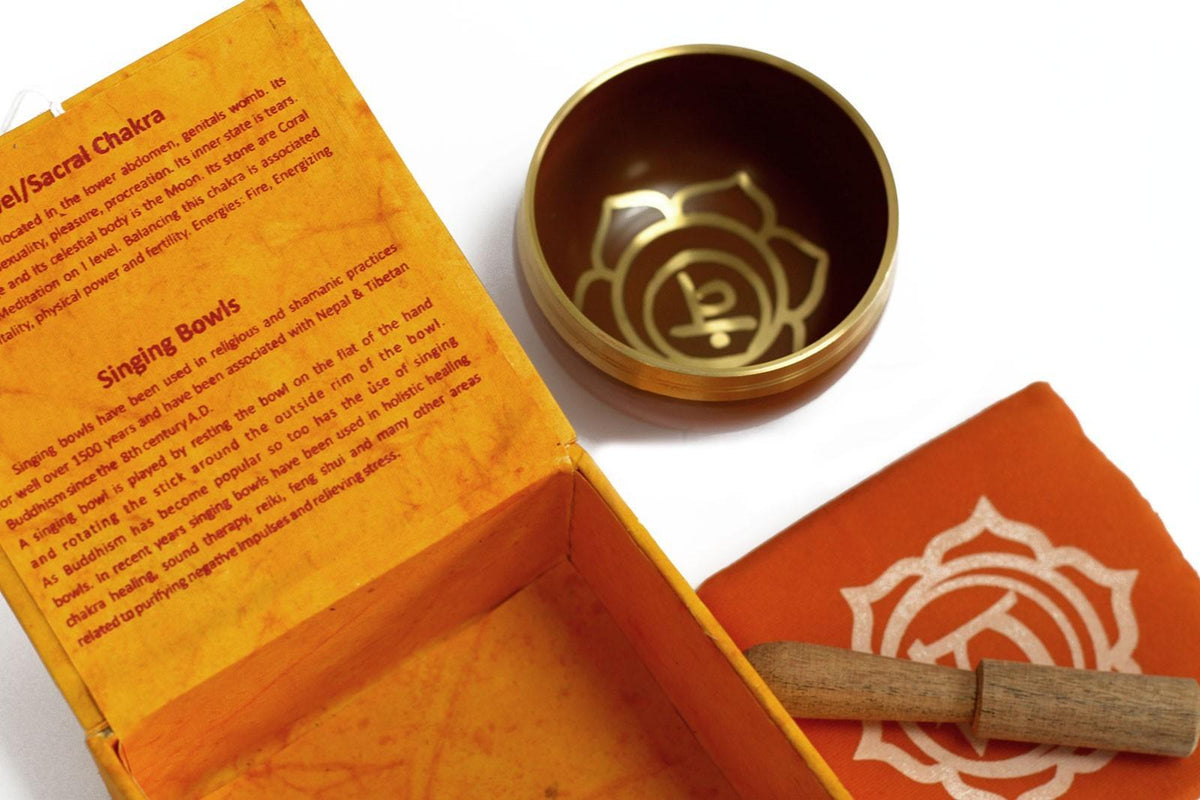 AW Gifts chakra singing bowl in navel size, a metal accessory with intricate design, used for meditation and sound healing.