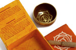 AW Gifts chakra singing bowl in navel size, a metal accessory with intricate design, used for meditation and sound healing.