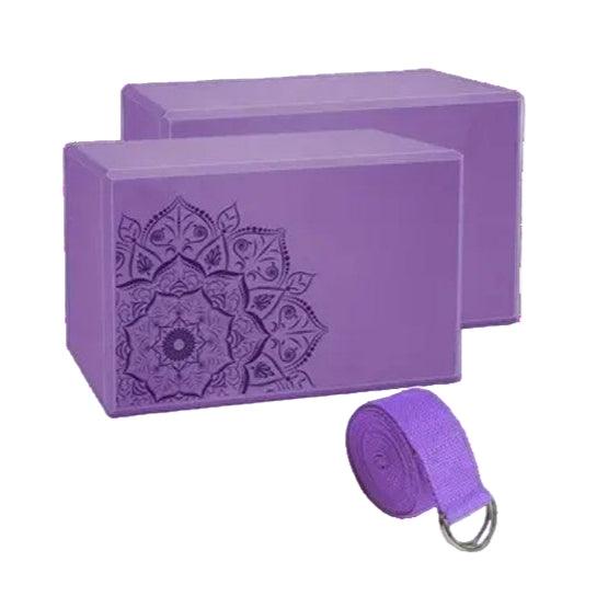 Set of three purple yoga blocks with a matching stretch strap, ideal for yoga practice and flexibility exercises.