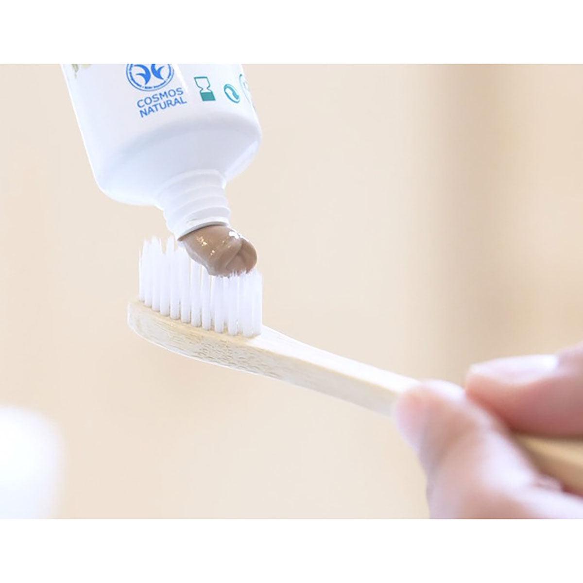 Herbalistas Maharishi Ayurveda Ayurdent Mild Toothpaste 75 ml tube showing herbal ingredients and toothpaste texture.