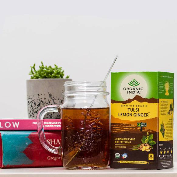 Organic India BIO Tulsi Lemon Ginger Tea in 25 infusion bags, featuring fresh lemon and ginger herbs in a caffeine-free herbal tea.