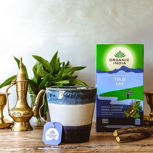 Organic India BIO Tulsi Tea with Lax, caffeine-free infusion bags, featuring fresh tulsi leaves in a tea bag.