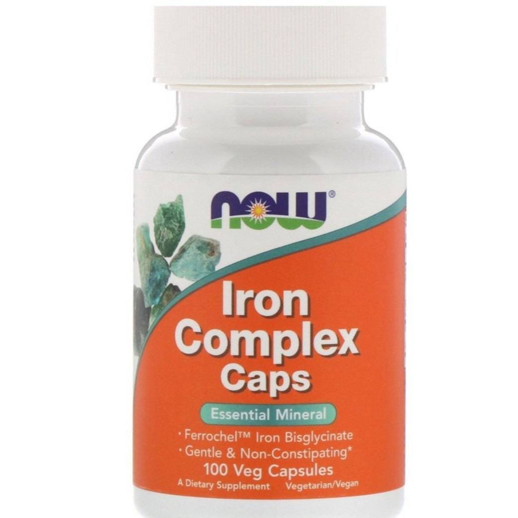 NOW Foods Iron Complex supplement bottle with 100 capsules, featuring white label and black cap, on a plain background.