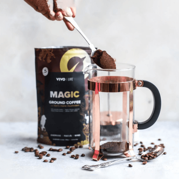 Vivo Life Magic Organic Coffee with Lion’s Mane Mushroom, brewed in a cup showing rich dark coffee and mushroom flavor.